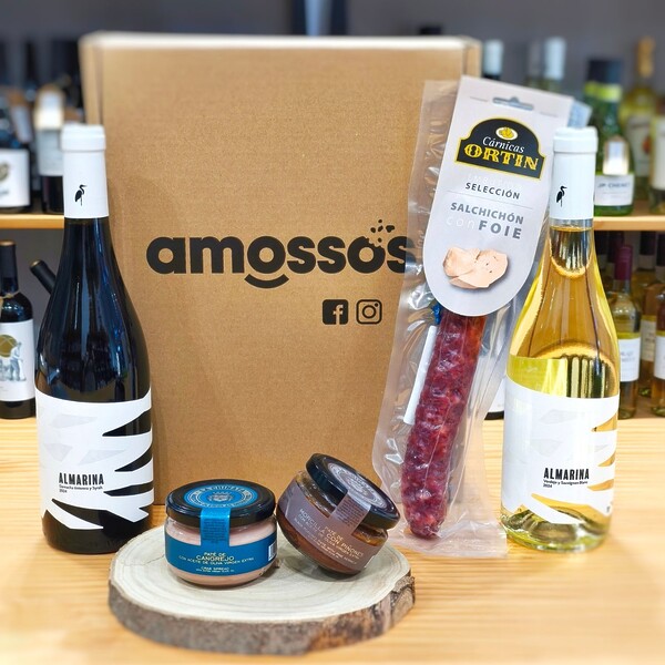 Caja gourmet con vino blanco y vino tinto, patés de carnes y pescado, y un embutido de foie